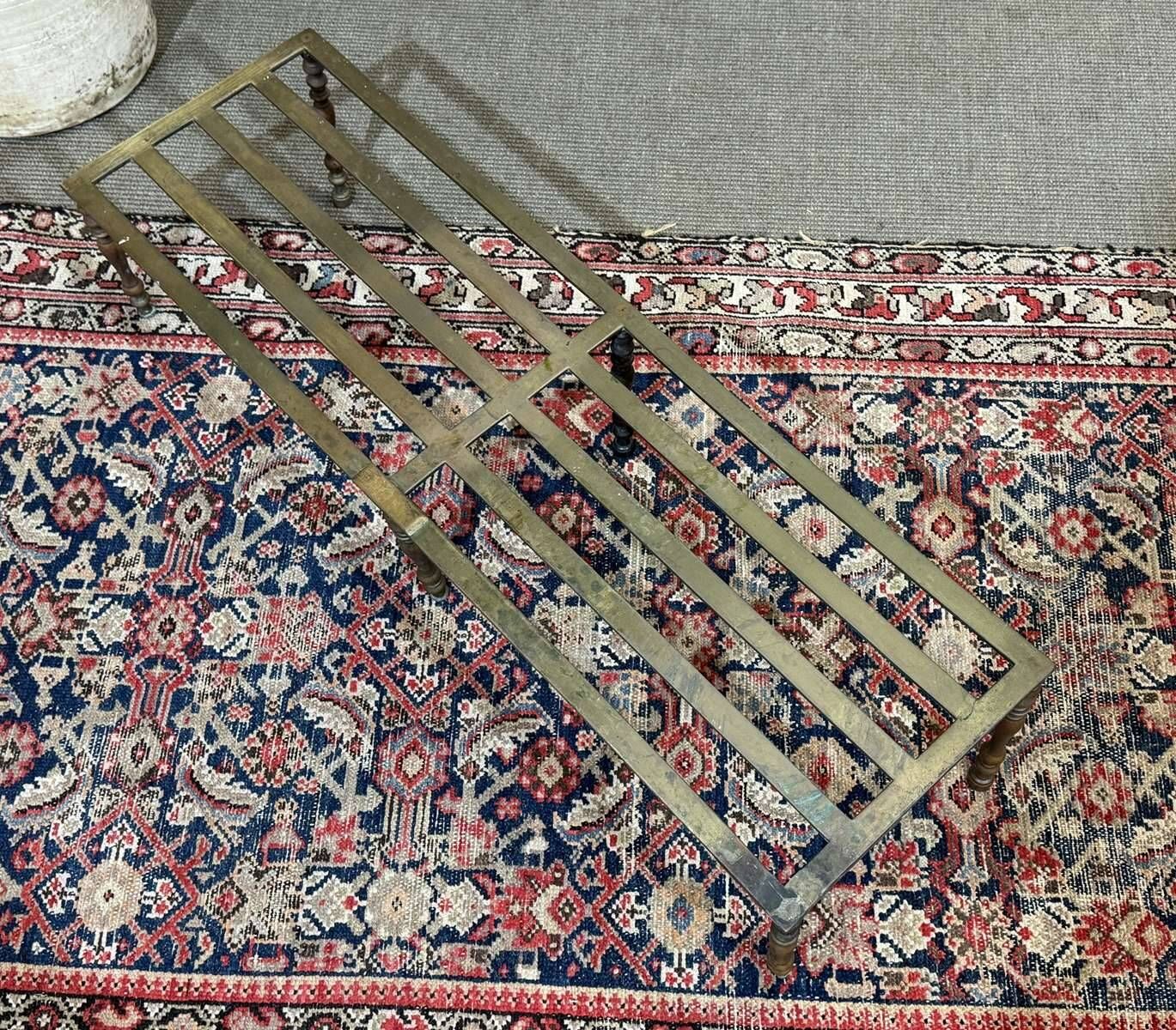 English brass footrest for fireplace from the late 19th century.