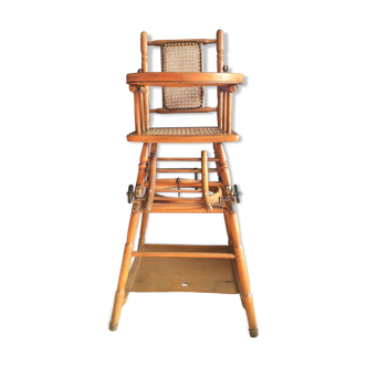 Old baby high chair in wood and caning