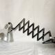 Vintage accordion wall light in chrome metal.
