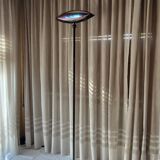 Adjustable floor lamp, Aeto. Designed by Fabio Lombardo for Flos