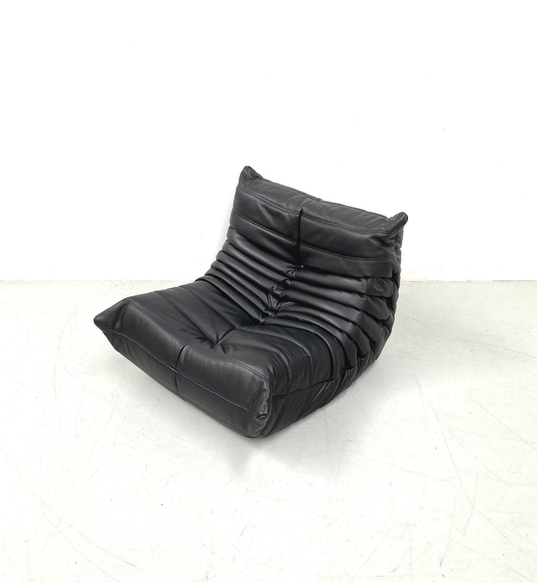 Togo chair and pouffe-black leather attributed to Ducaroy for Ligne Roset.