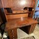Vintage desk with drawers and a hutch with numerous drawers.