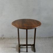 Small table known as a winemaker's table.