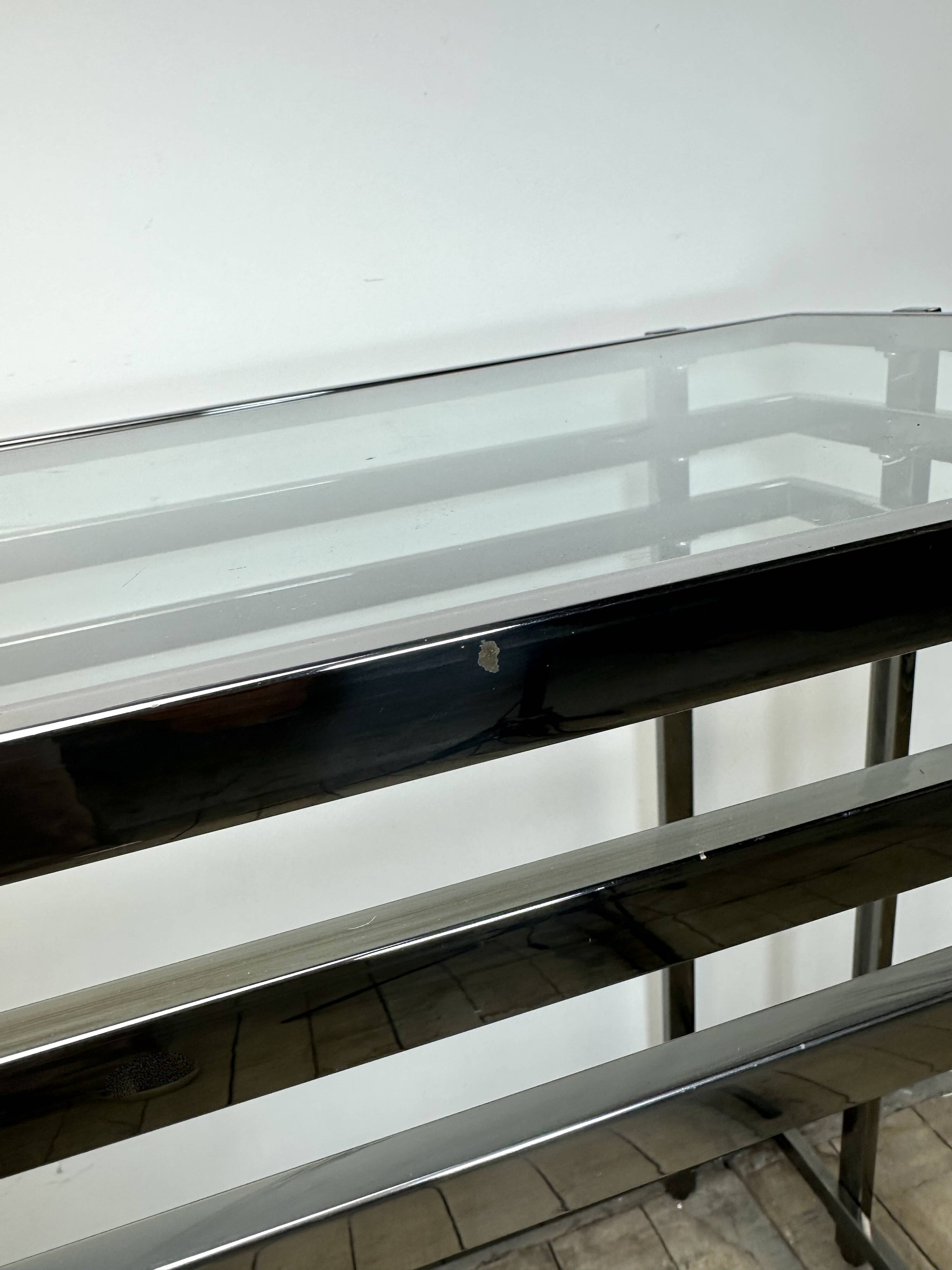 Smoked silver metal console from the 2000s.