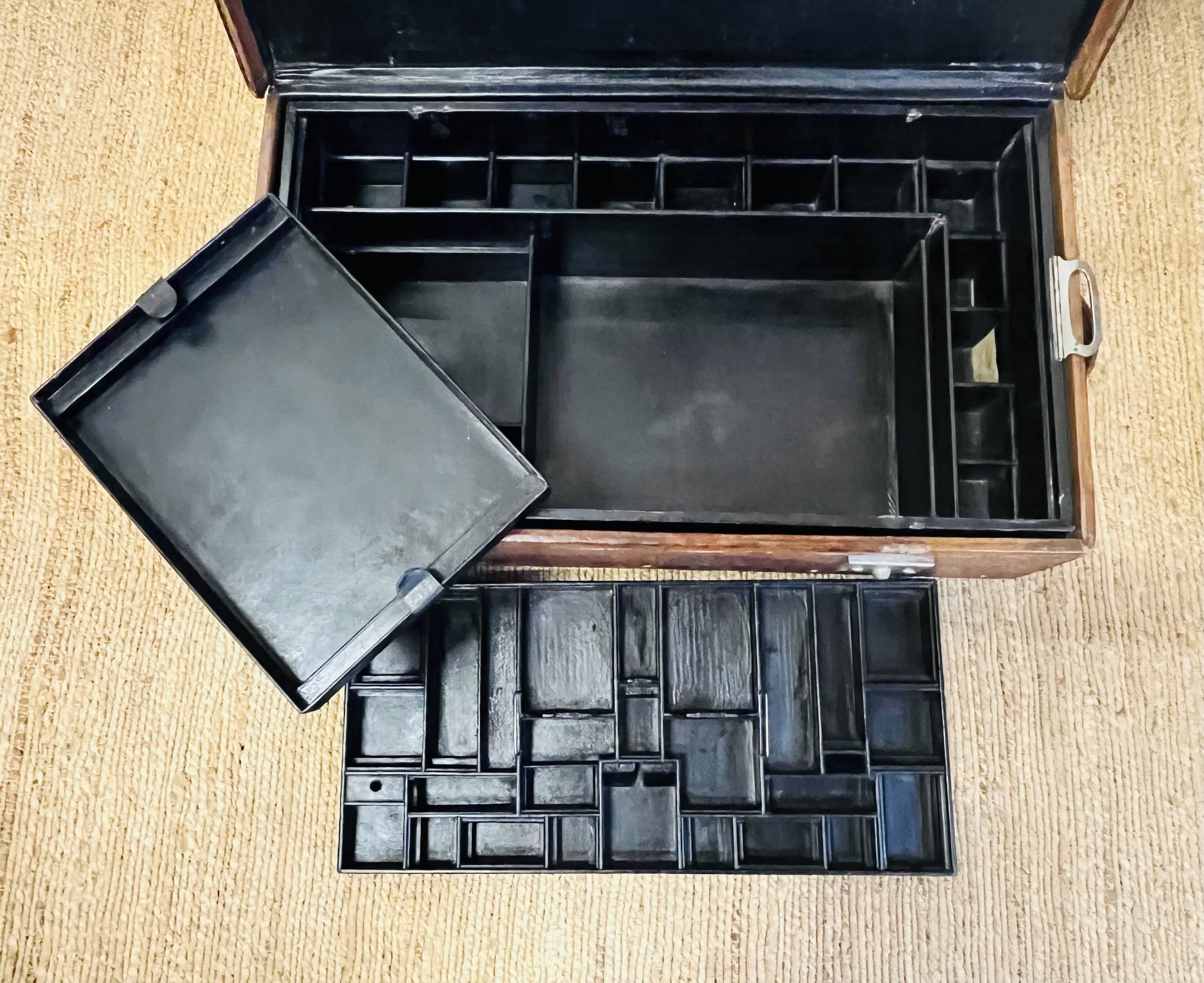 Large Gustave Keller leather trunk with multiple compartments