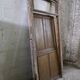 Old solid oak front door with frame and transom from the 19th century.
