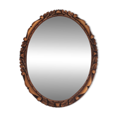 Oval wall mirror in gilded wood