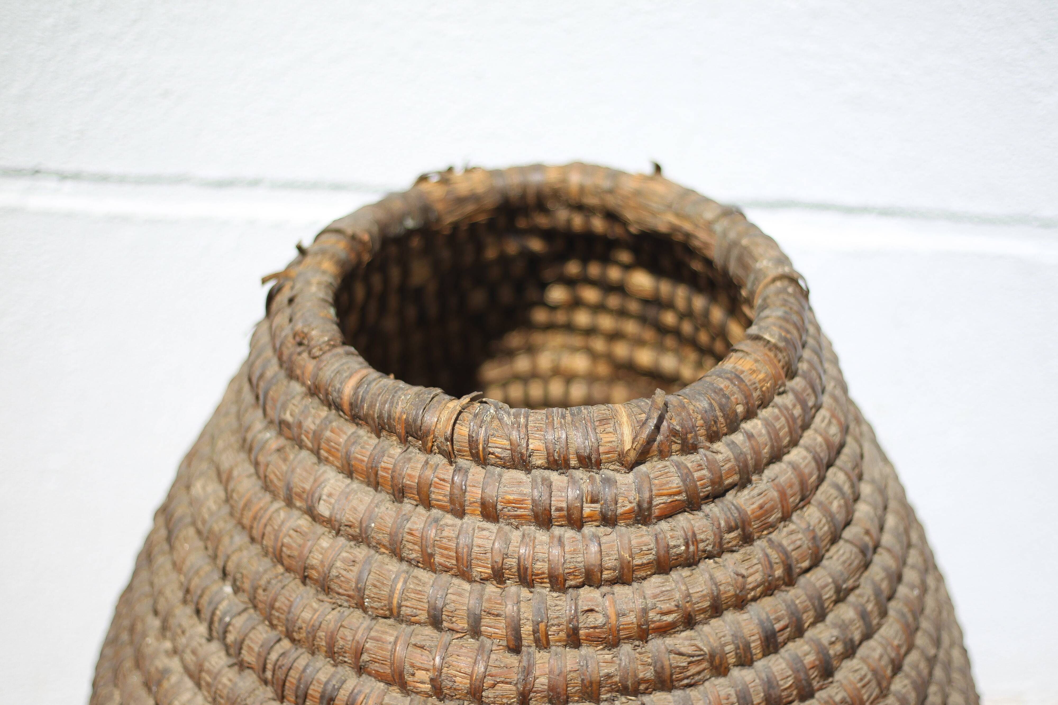 Old basket, burgundy straw and bramble, woven basket, interior decoration