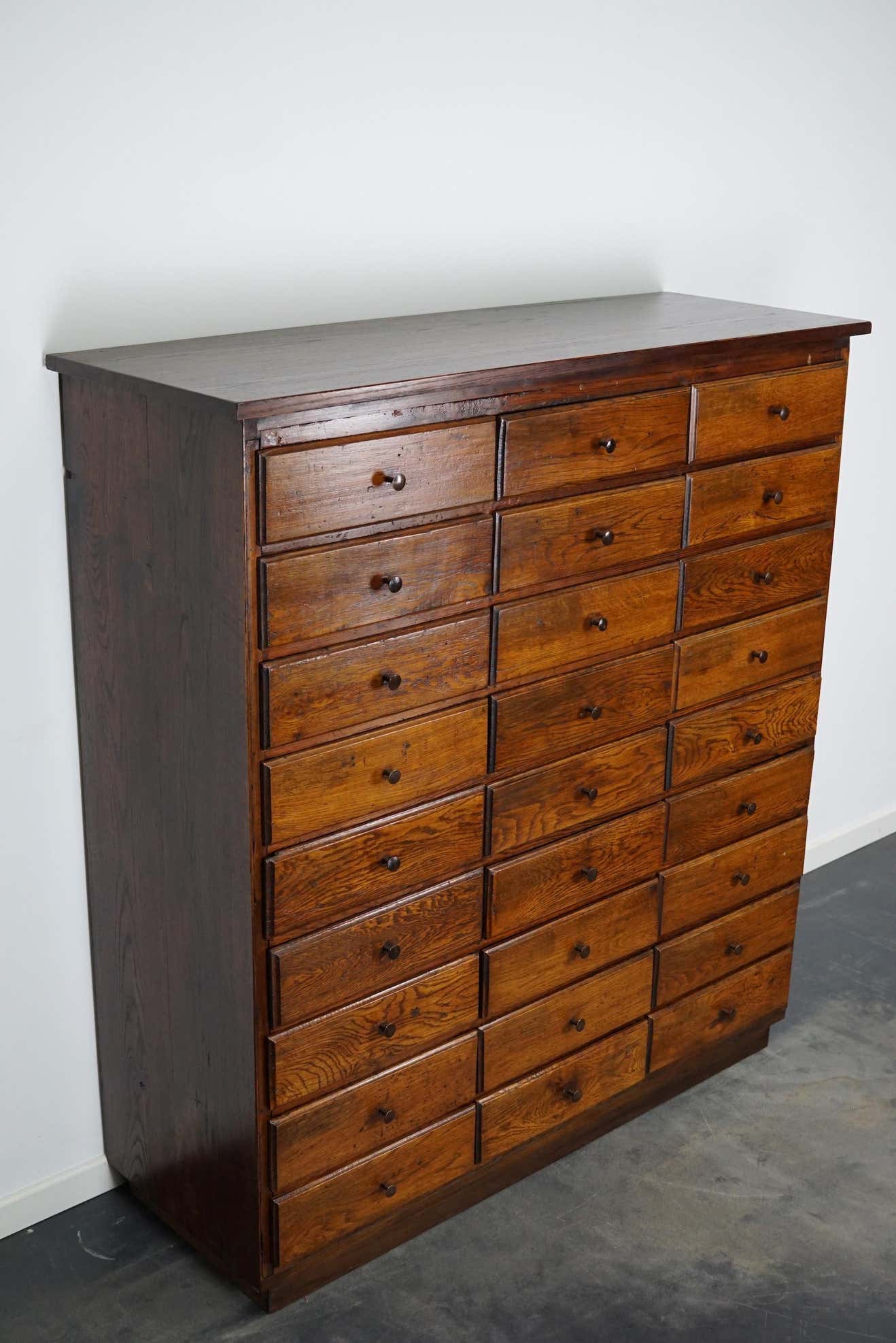 Antique apothecary furniture in oak France early twentieth century