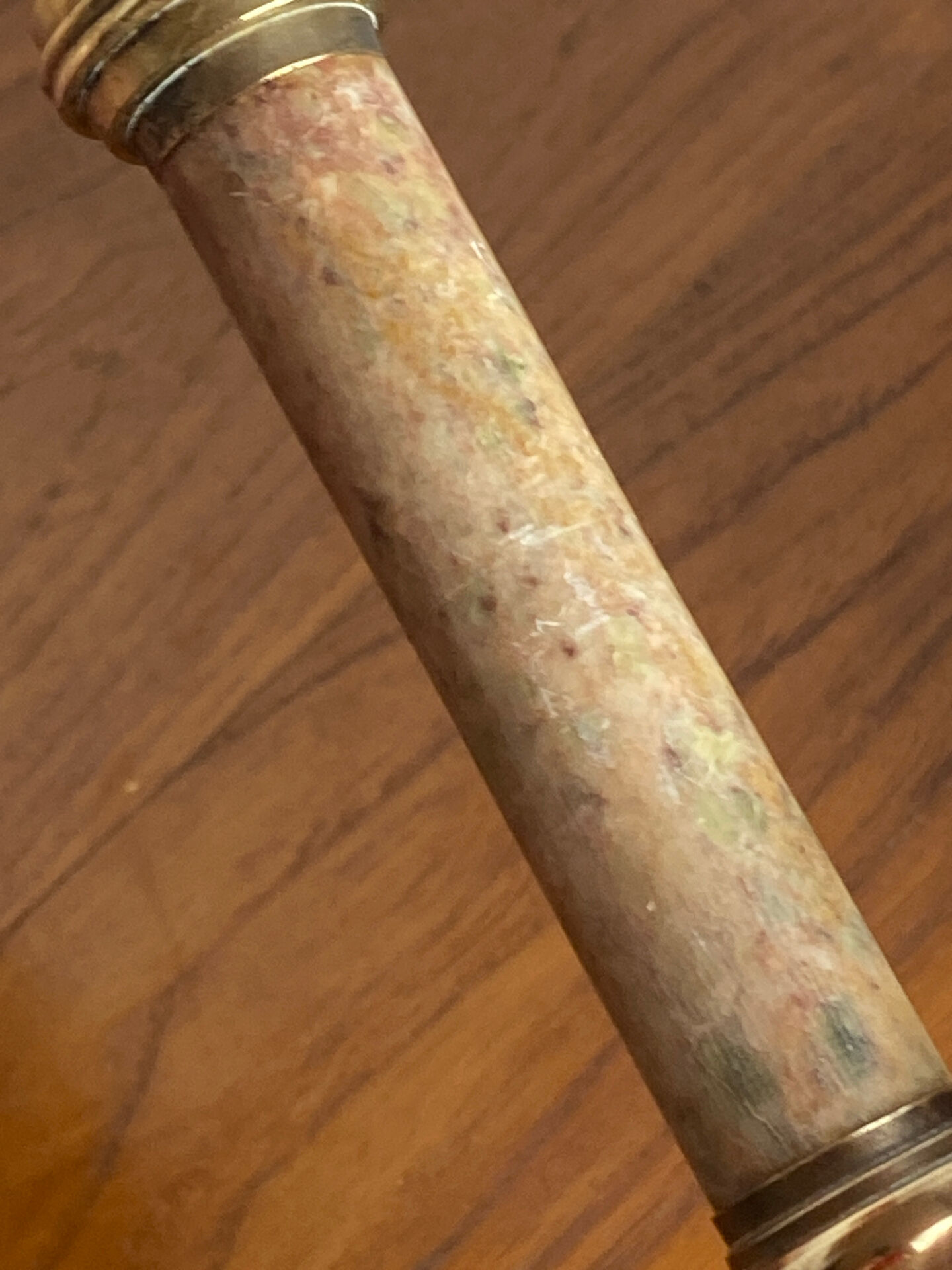Pair of brass and stone candlesticks