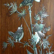 Asian screen in carved wood and mother-of-pearl marquetry.