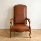 Classic vintage armchair in brown leather and oak