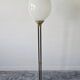 Mid-Century floor lamp with egg-shaped opal glass shade, brass base, marble base.