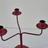 Red metal chandelier for three candles