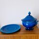 Blue ceramic soup tureen and crackled finish trivet.