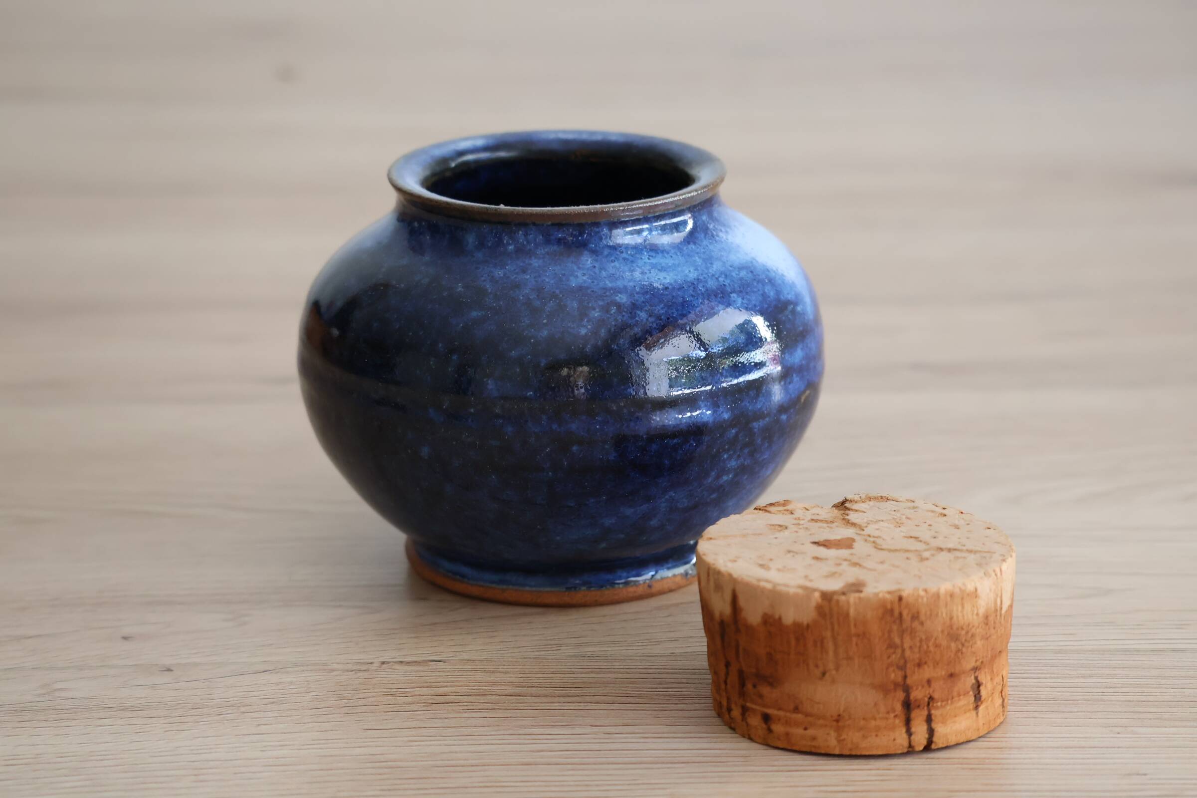 Blue glazed stoneware pot with cork stopper