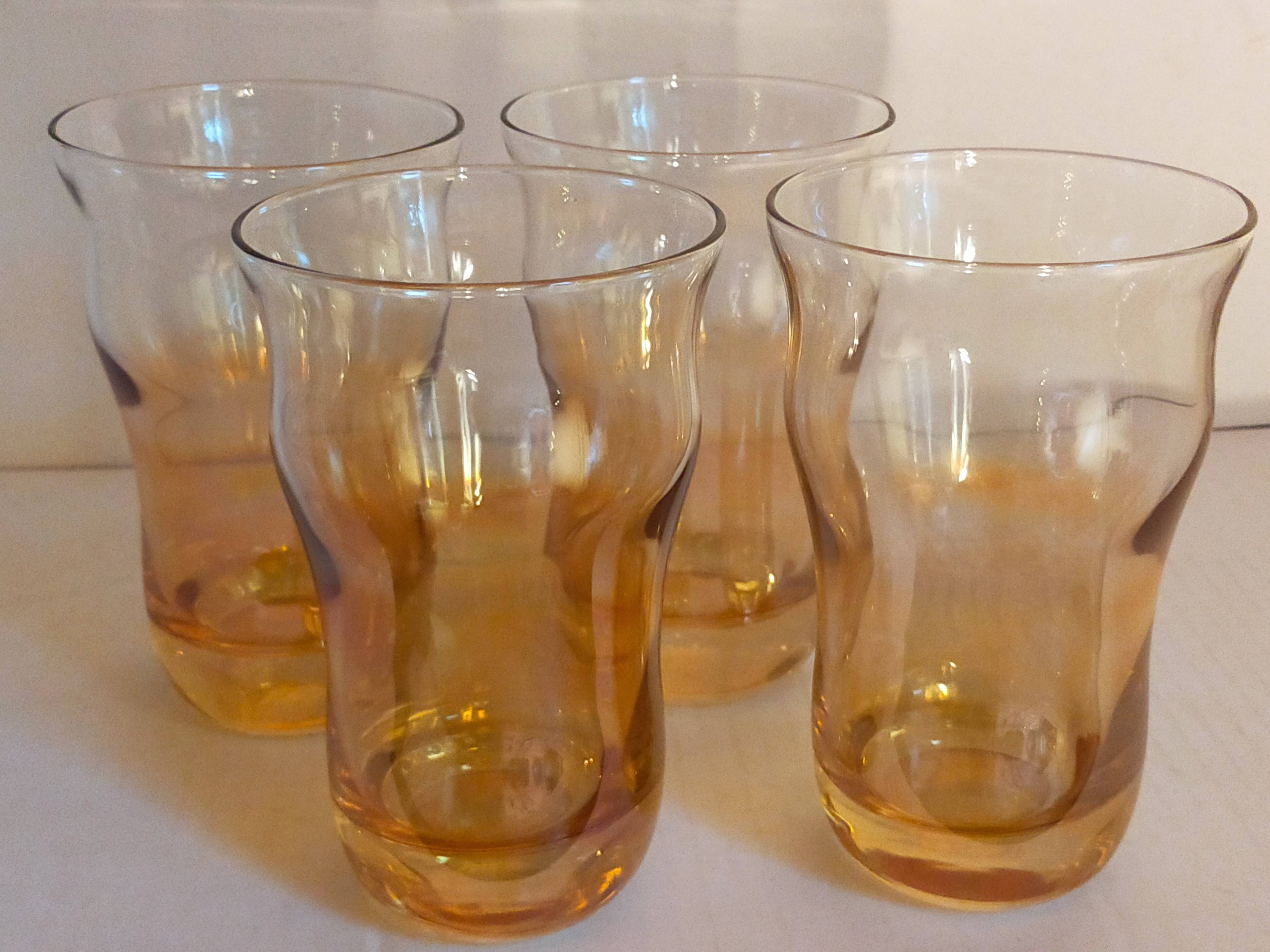 Four iridescent honey blown glass glasses