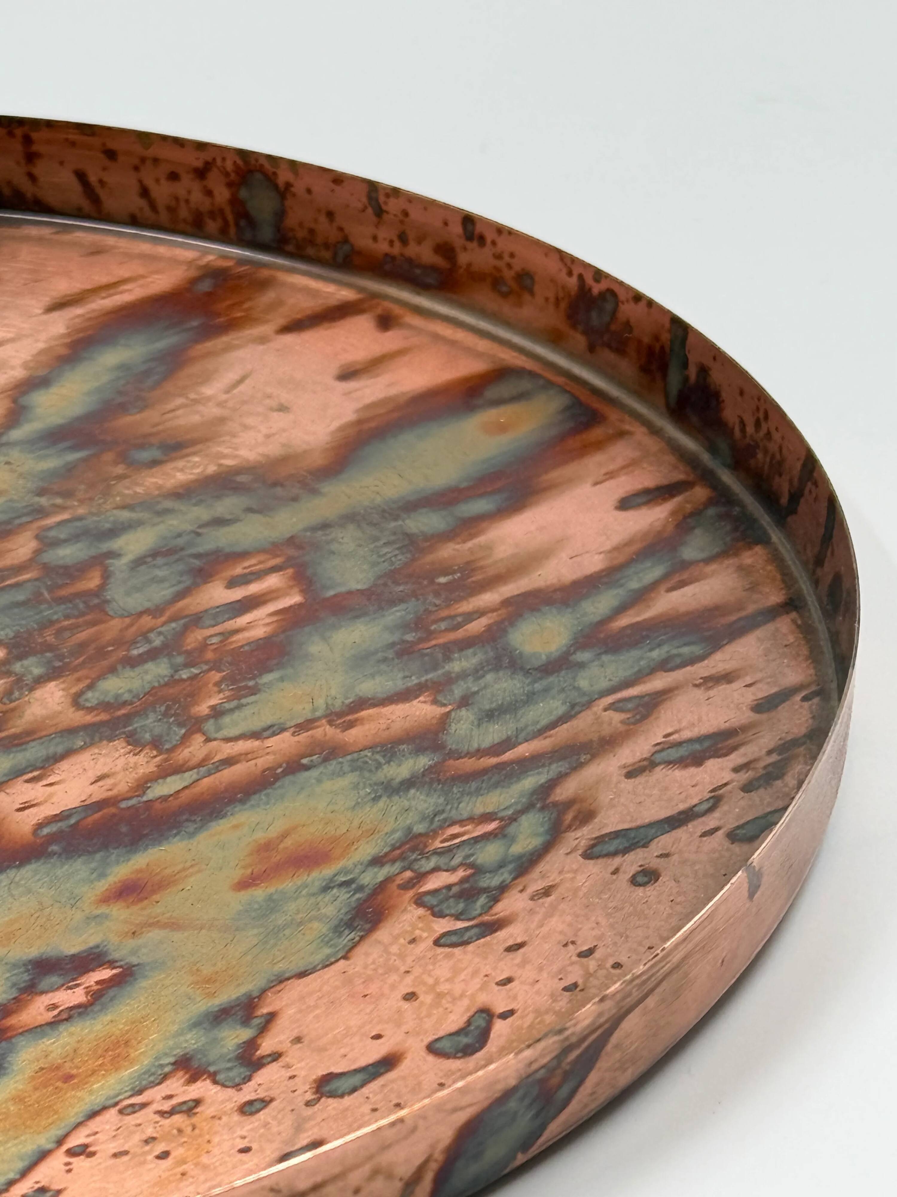 Round patinated copper platter, textured finish