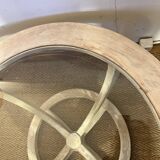 Oval patinated wood and beveled glass coffee table