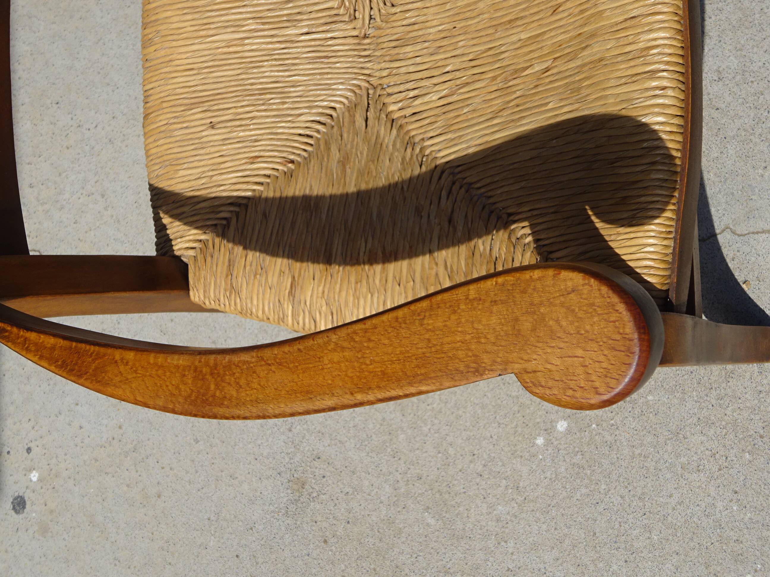 Grandfather's armchair in wood and straw.