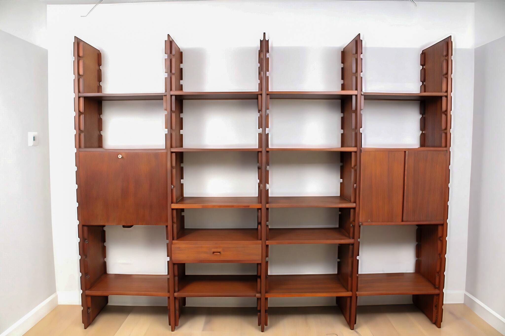 A vintage mid-century teak Gianfranco Frattini style bookcase room divider