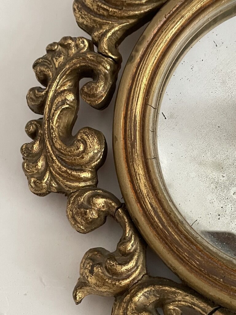 Old mirror in gilded wood