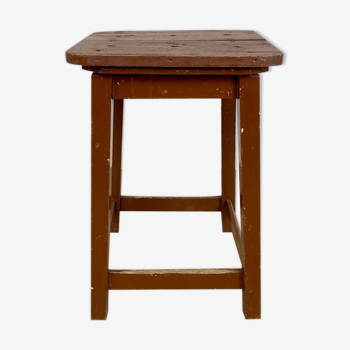 Old solid chocolate wooden stool