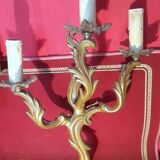 Pair of rococo style gilded bronze sconces with 3 light arms
