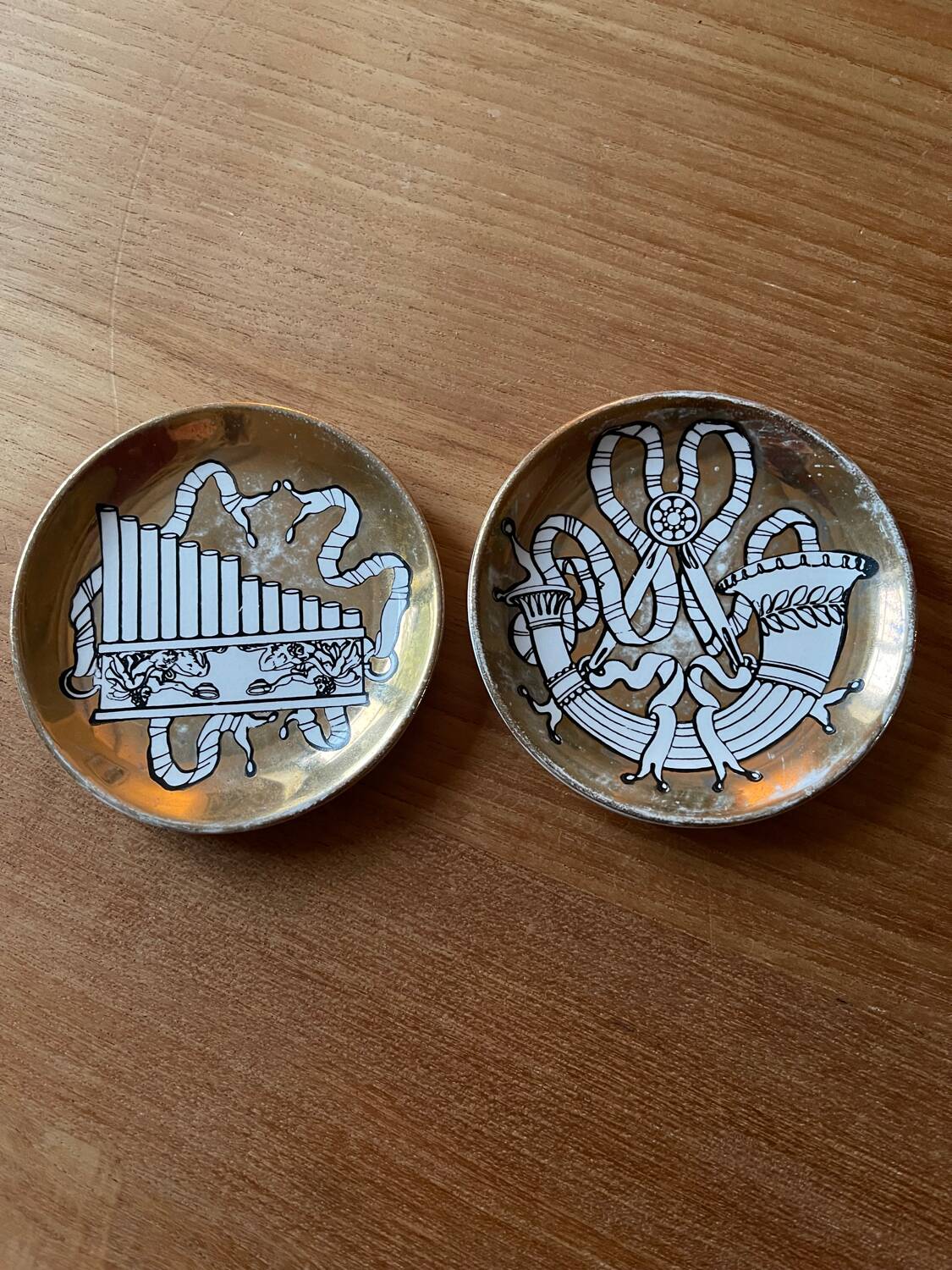 Small Fornasetti plates