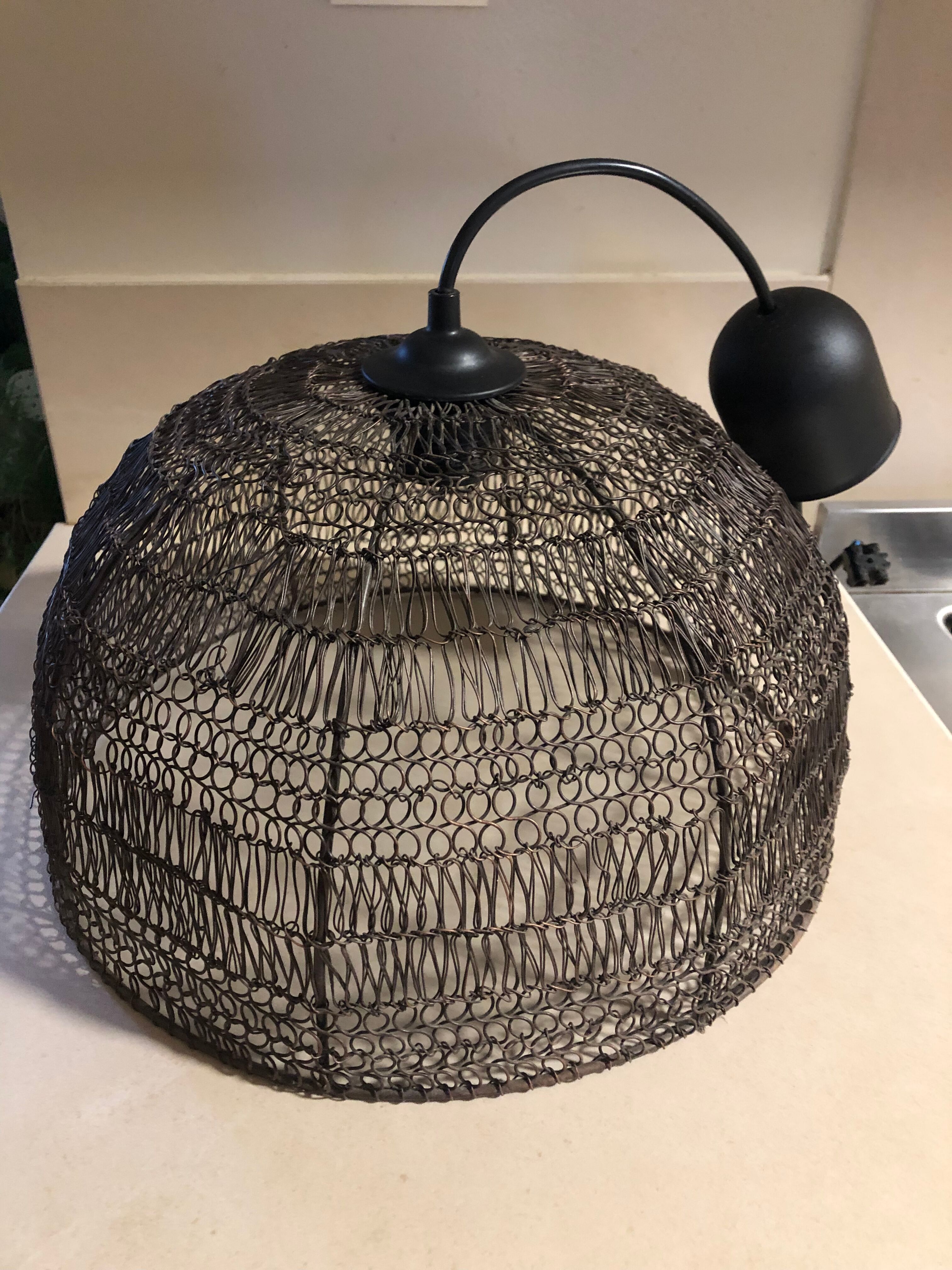 Woven metal suspension