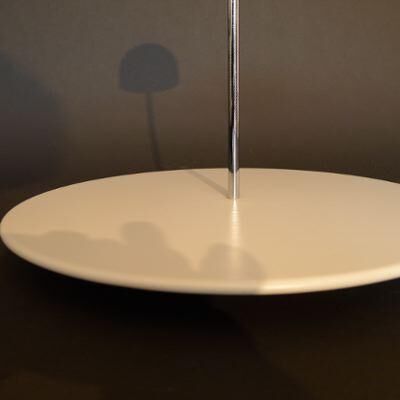 White lacquered metal base, axis steel topped by a cupola Artemide white porcelain