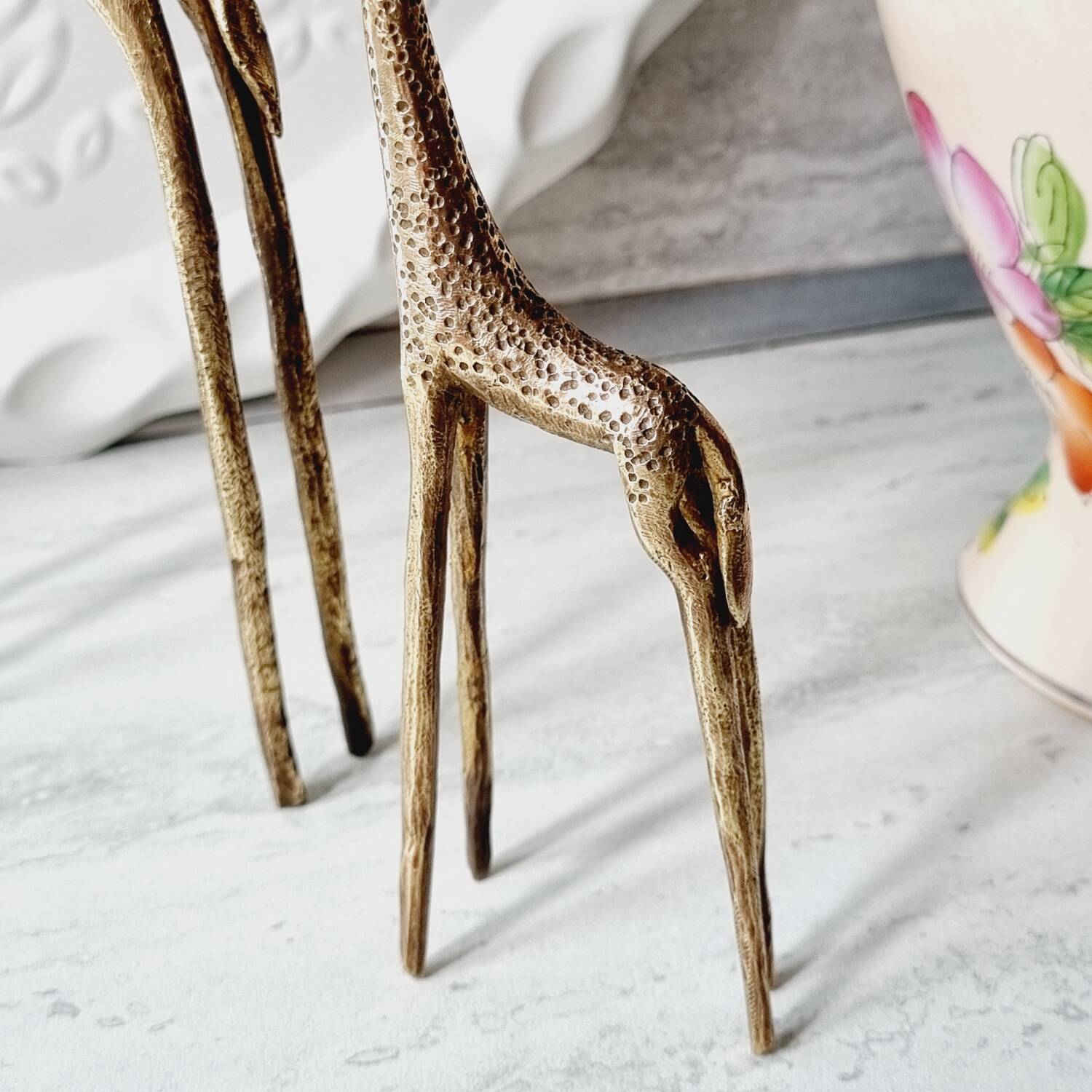 Stylized brass giraffes