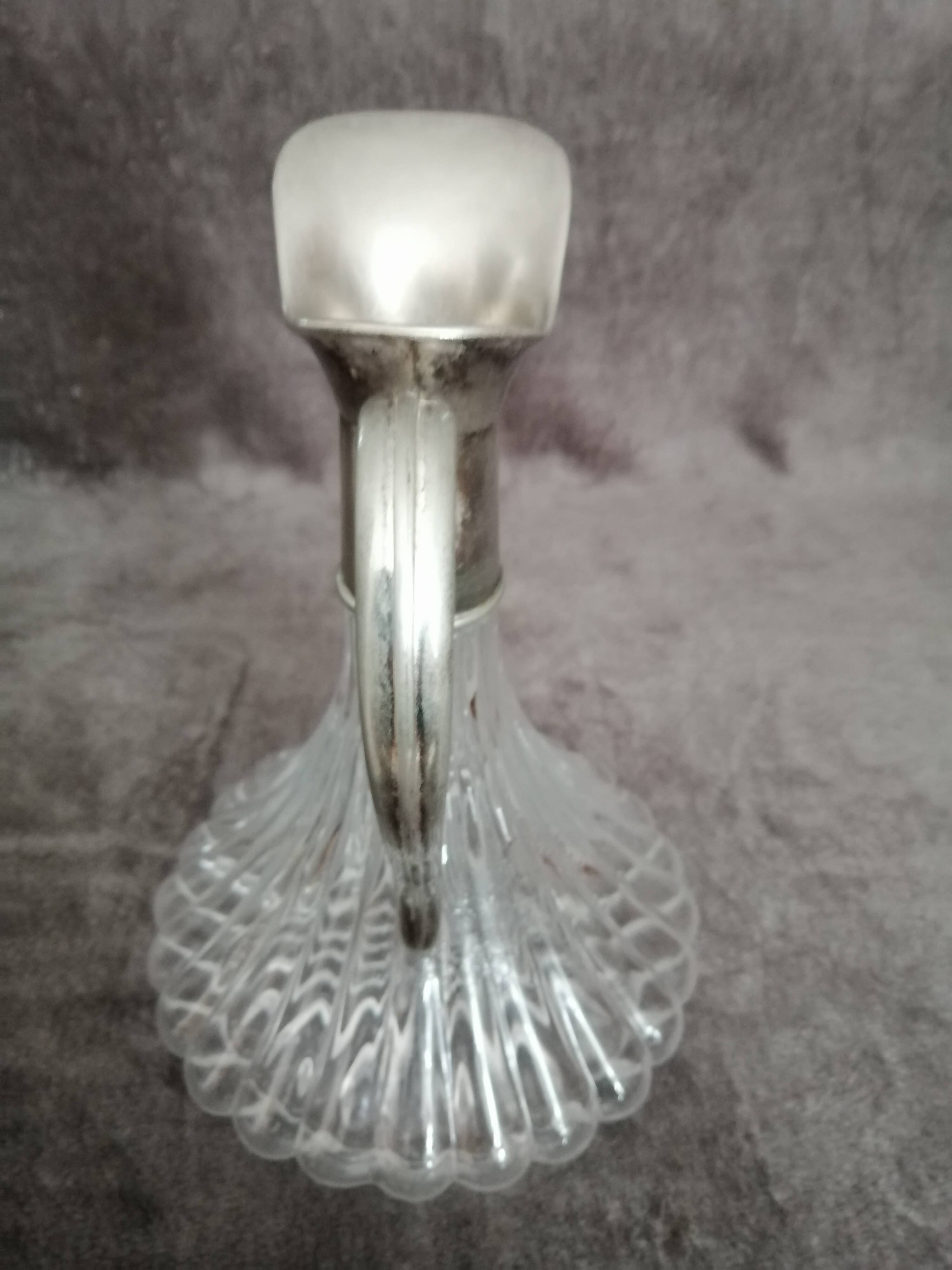 Glass and silver metal wine carafe