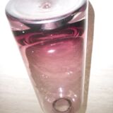 Plum-colored glass bottle with bubble