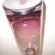 Plum-colored glass bottle with bubble