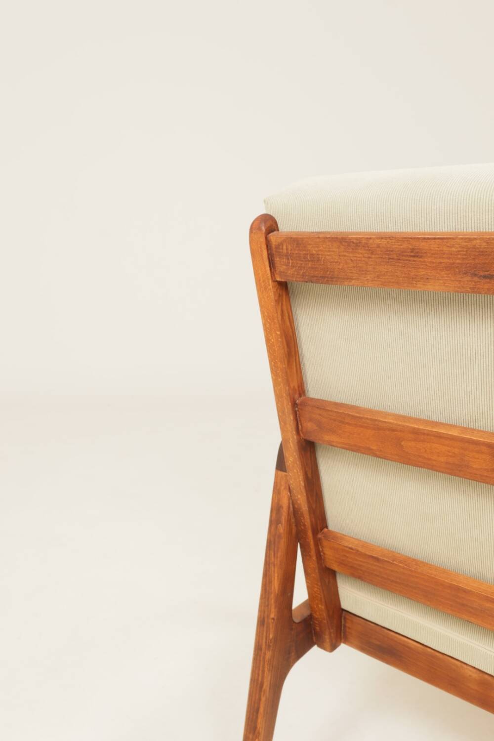 Vintage armchair in olive corduroy with a wooden frame.