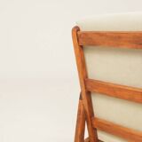 Vintage armchair in olive corduroy with a wooden frame.