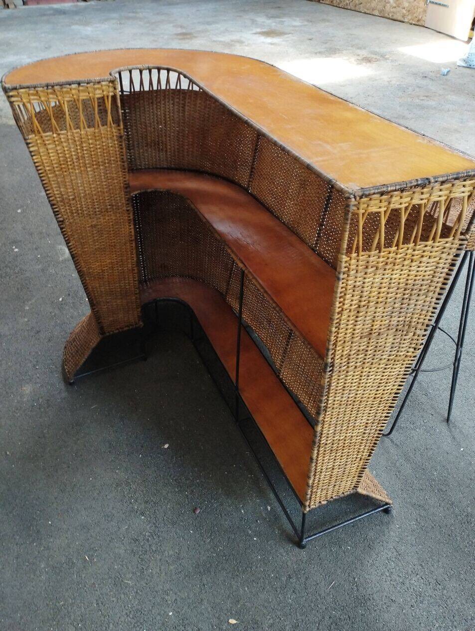 Vintage rattan and metal bar and its stools.