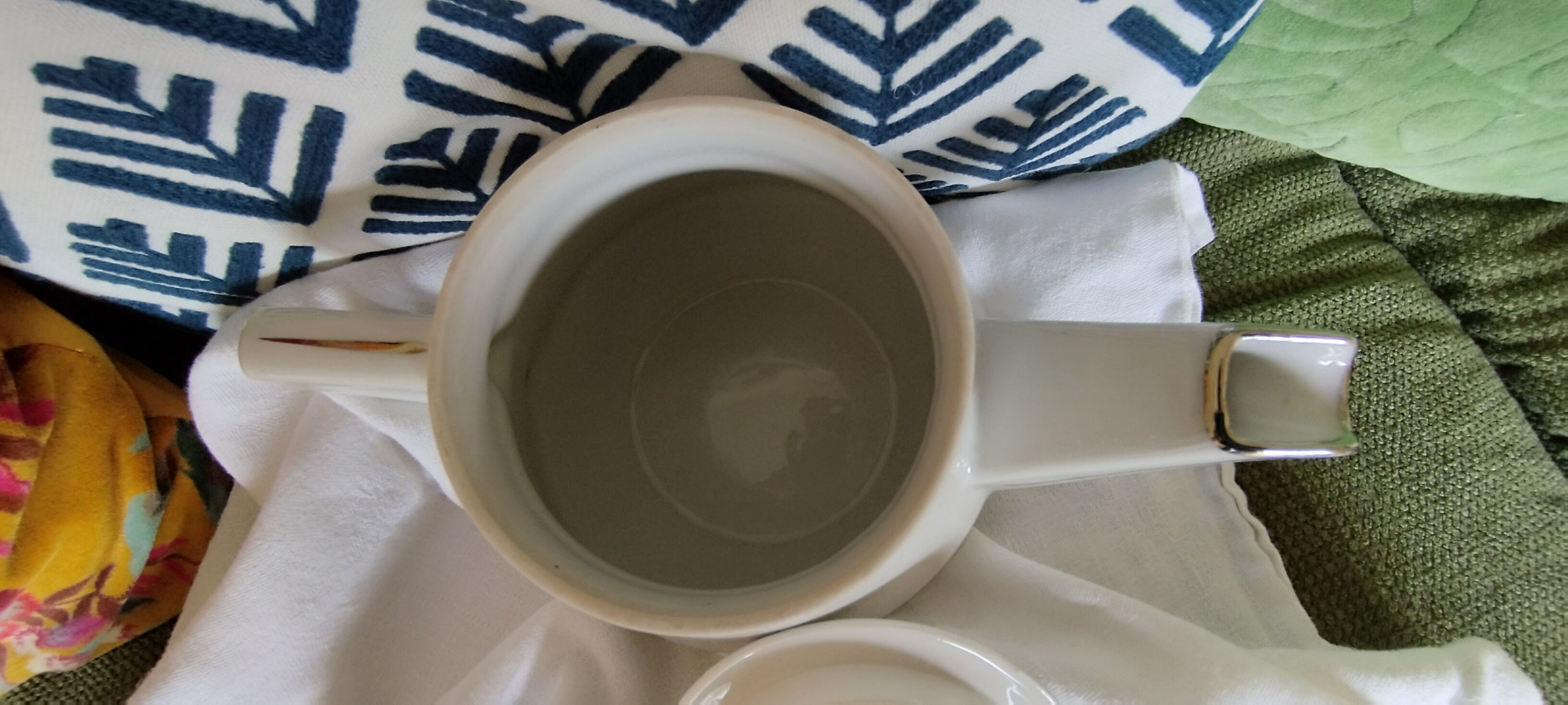 White and silver porcelain teapot