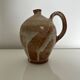 Patinated stoneware jug