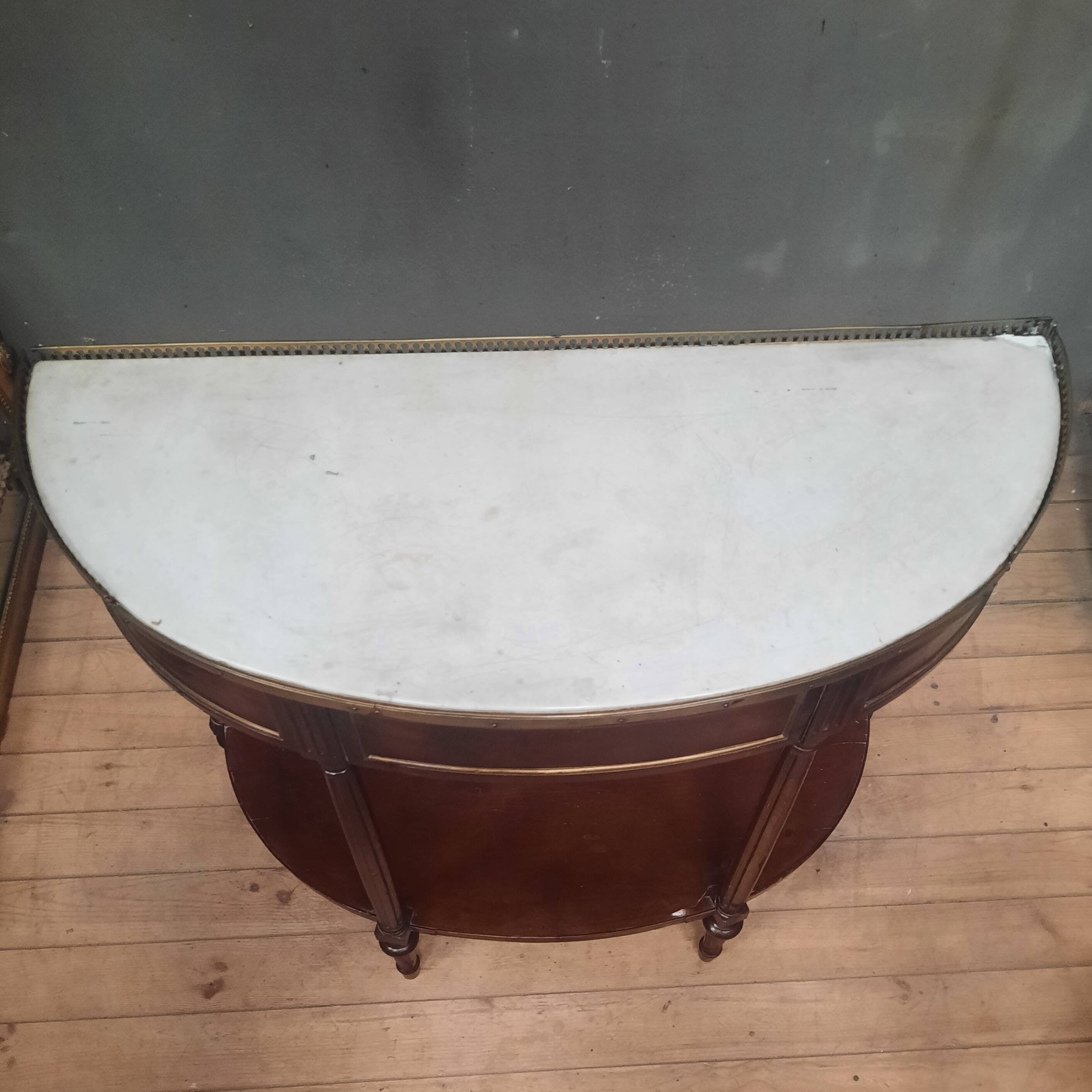Louis XVI period demi-lune console in mahogany.