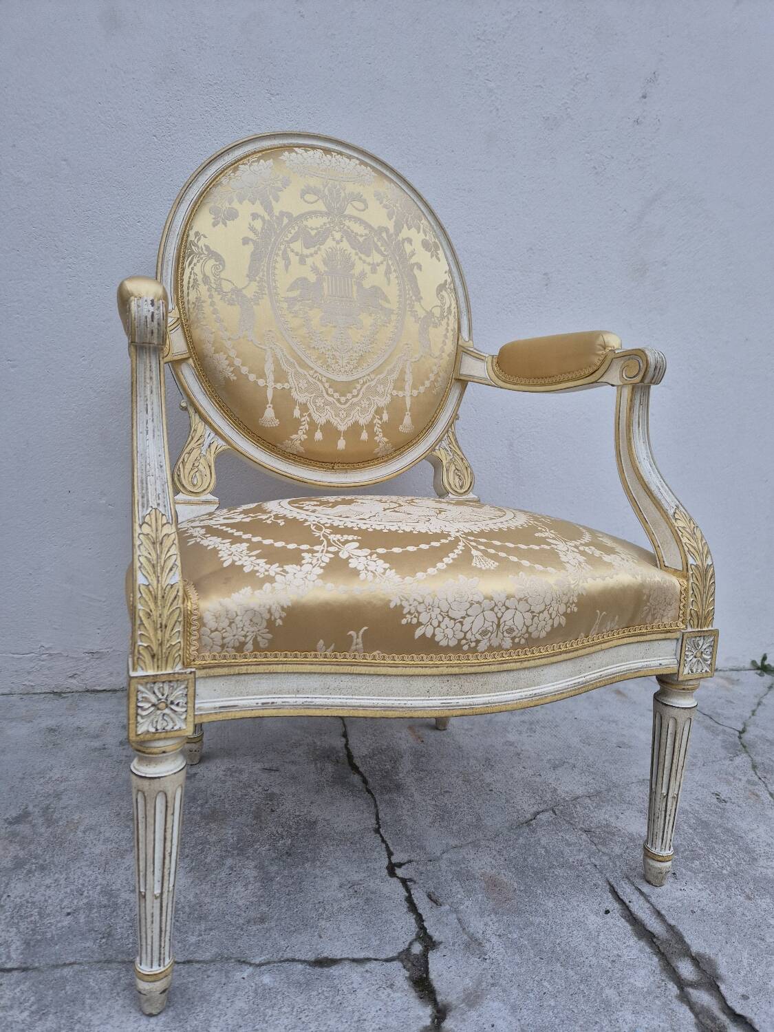 Louis XVI style cabriolet armchair with decorated medallion
