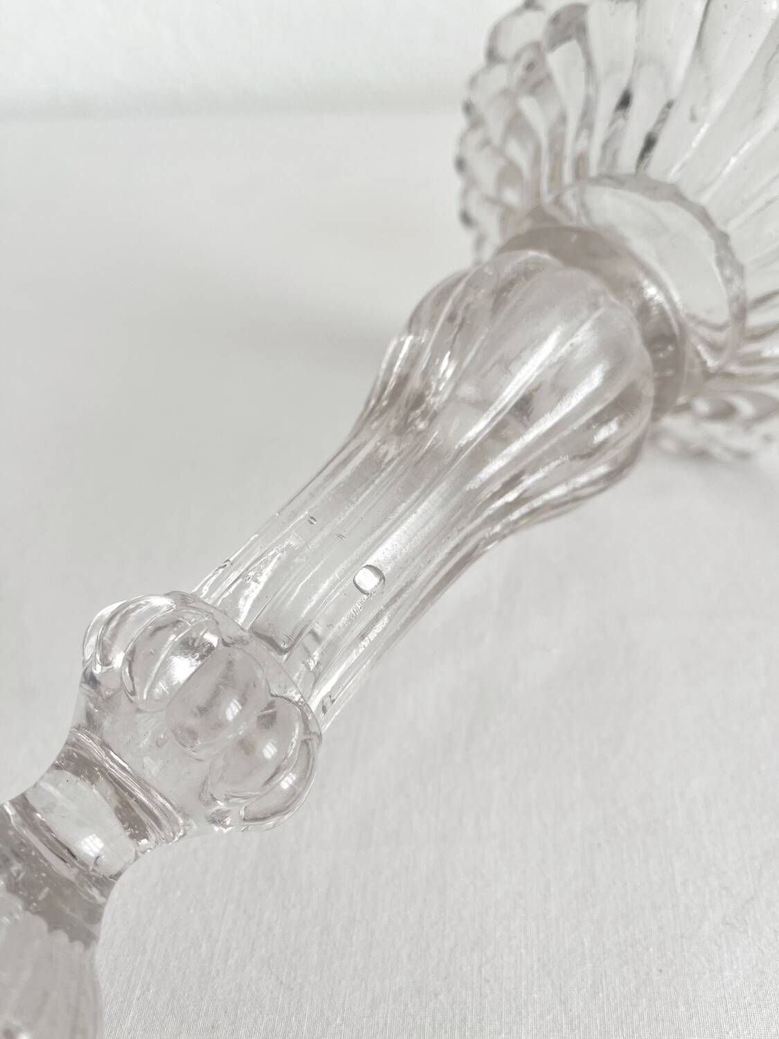 Antique baluster-shaped molded glass candlestick holder