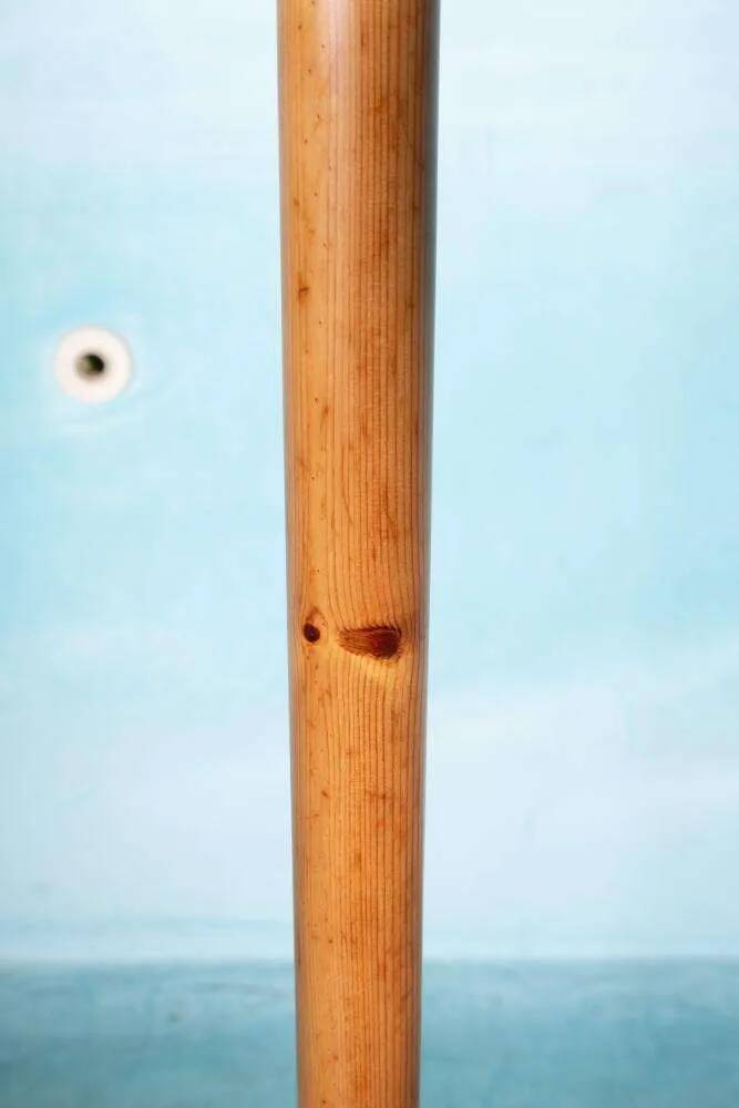 Minimalist organic coat rack in pine from the 1970s in space age style.