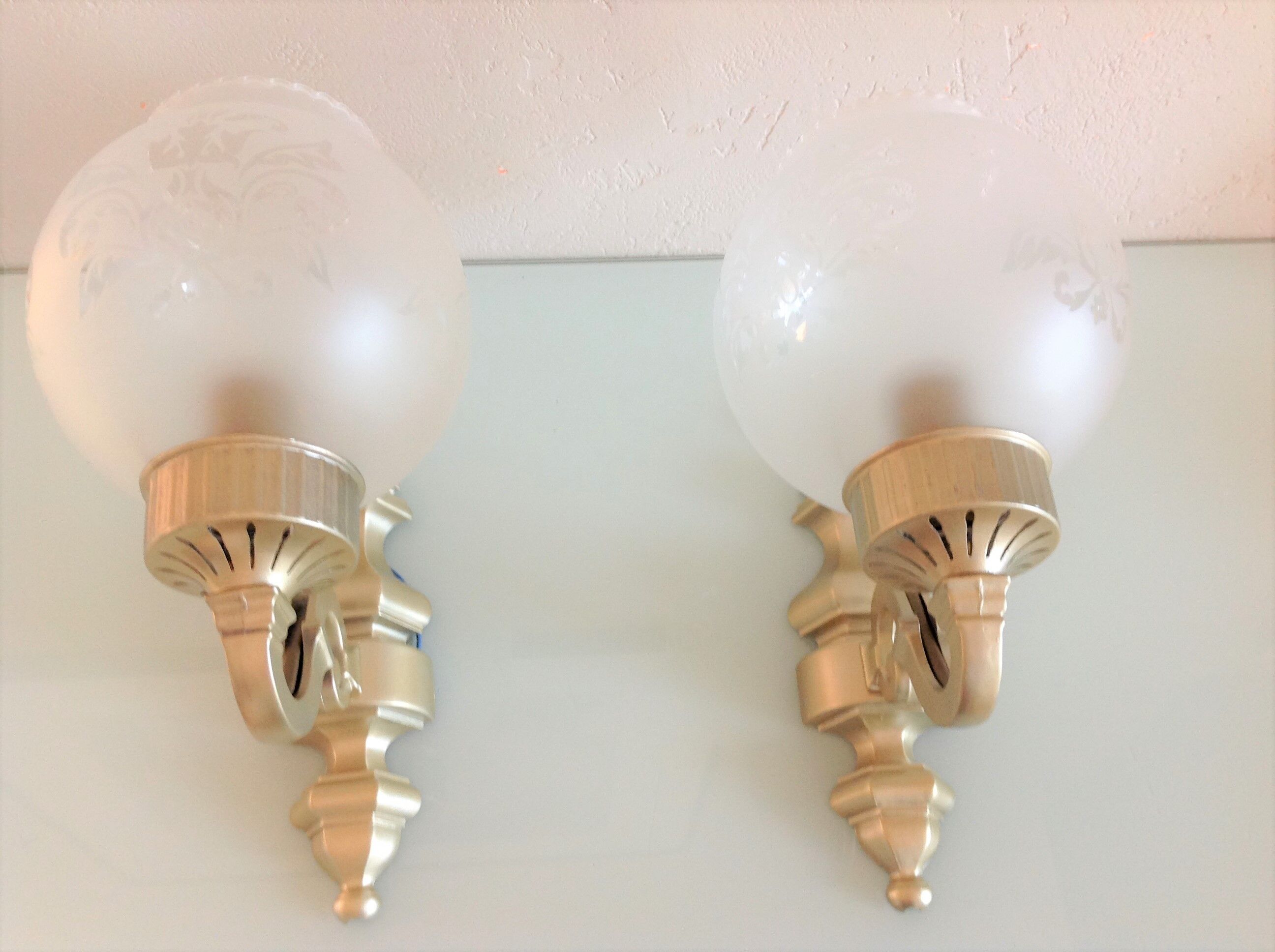 Pair of wall lamps in gilded metal and frosted glass art deco style
