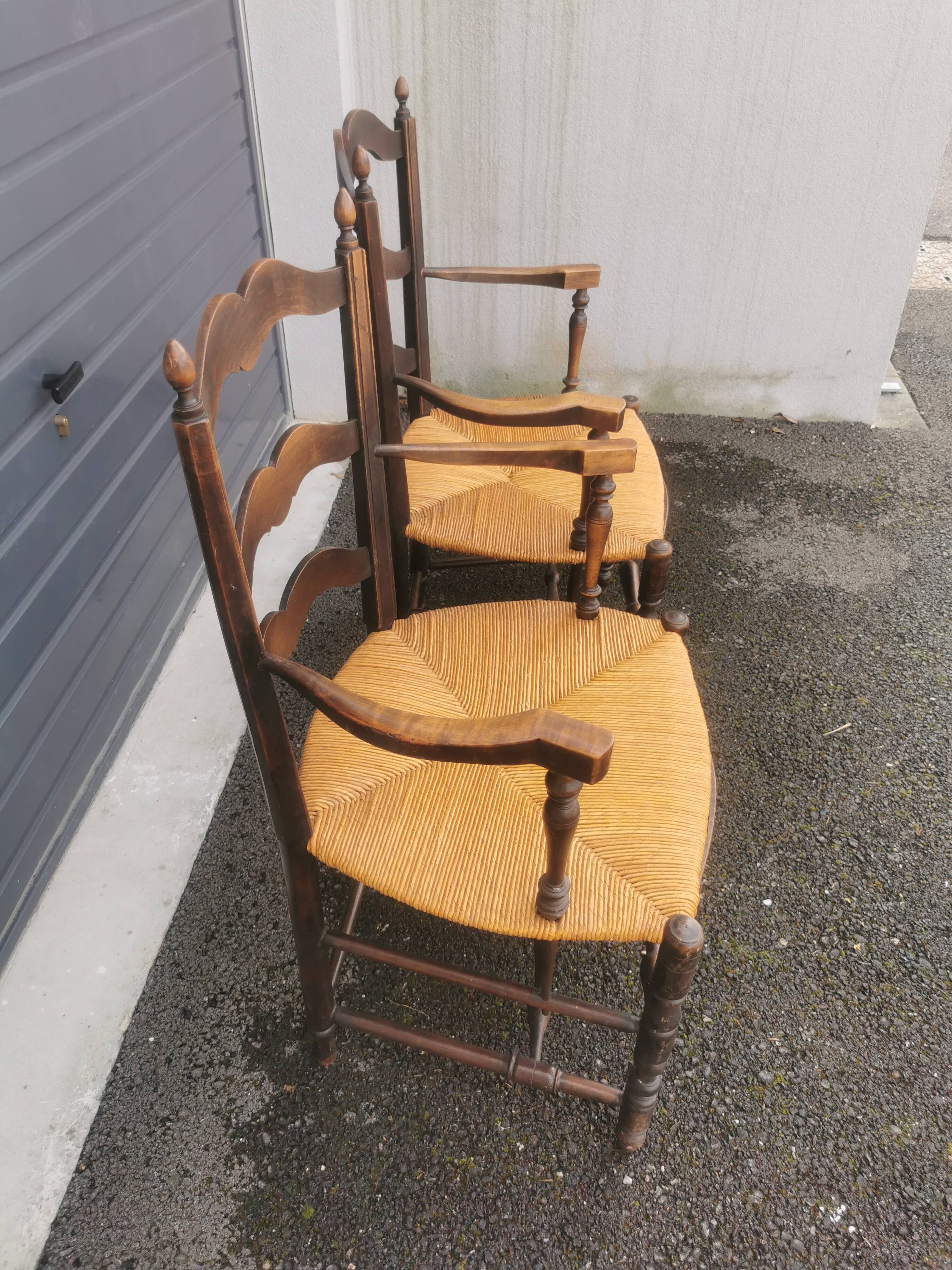 Pair of blackened wooden armchairs