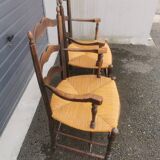 Pair of blackened wooden armchairs