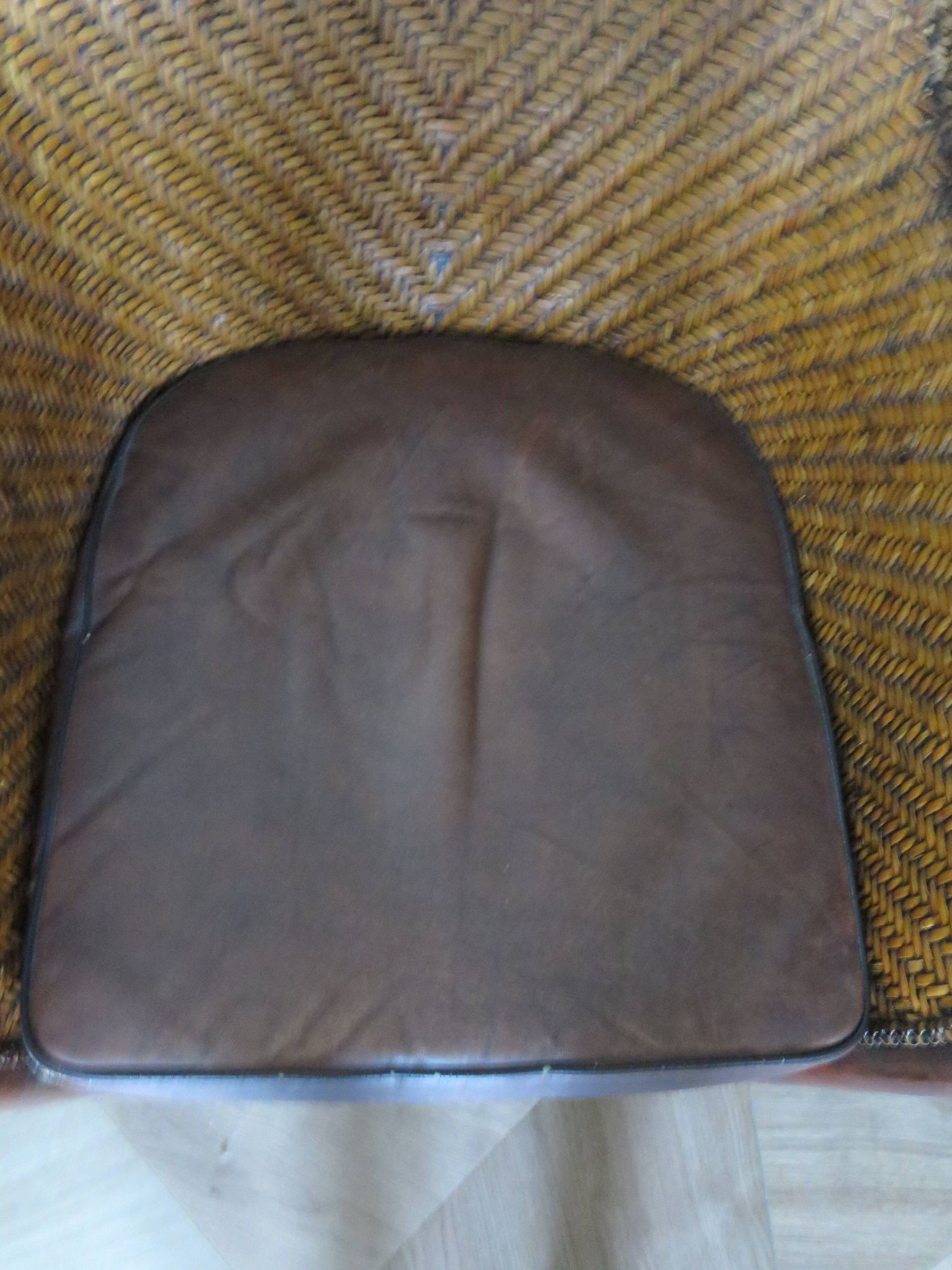 Woven rattan armchair and exotic wood in colonial style, 1980s.