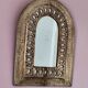 Small golden metal mirror in oriental style.