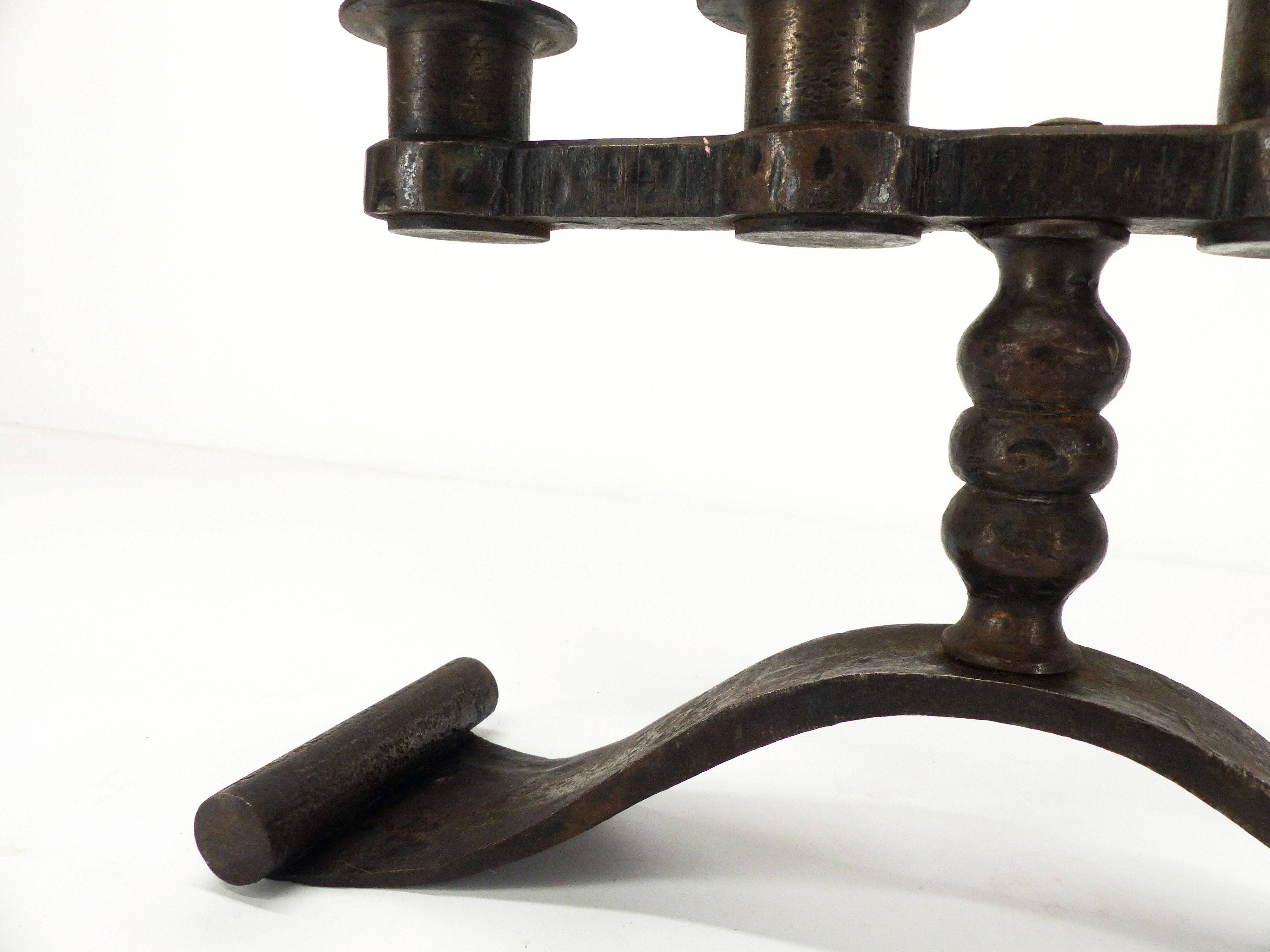 Wrought iron chandelier with four lights, Charles Piguet, Switzerland, circa 1930.